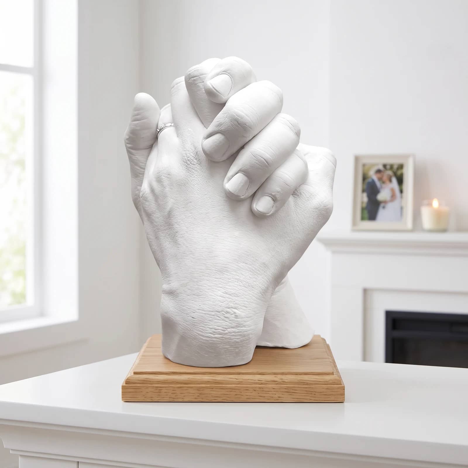 Finished cast of a couple's clasped hands